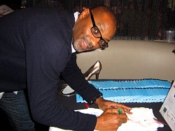 rodney van johnson signing wizard jeans for charity.jpg